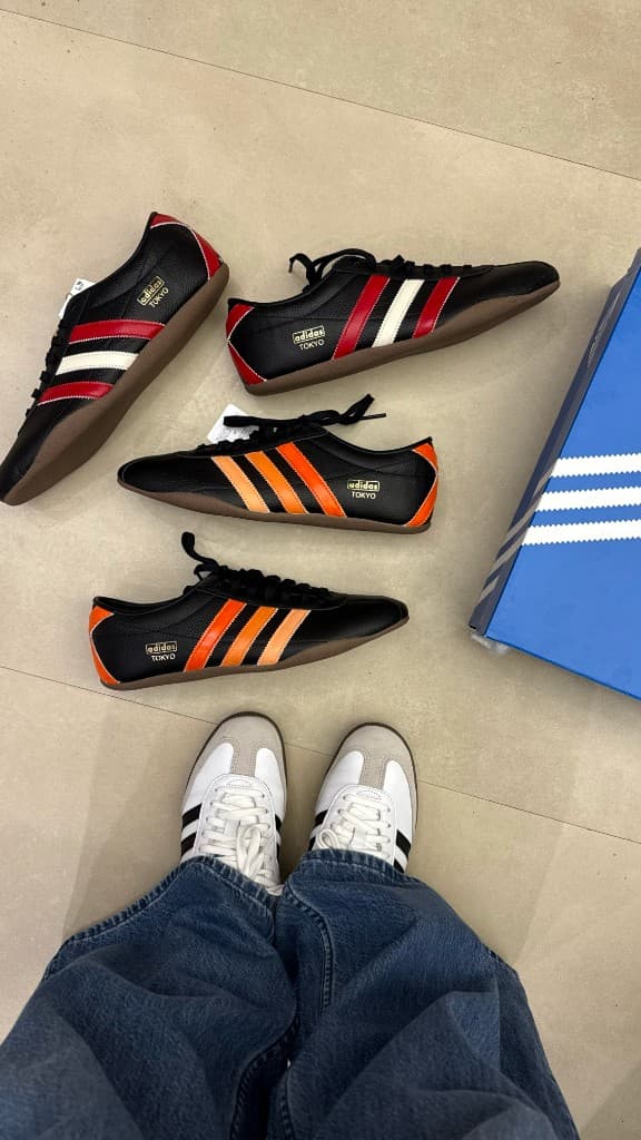 Custom Adidas sneakers laid out on the floor